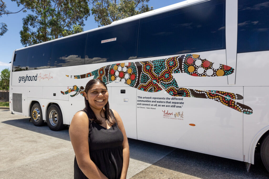 Yalari Alumna Lori Clevens with her artwork on one of the Greyhound coaches